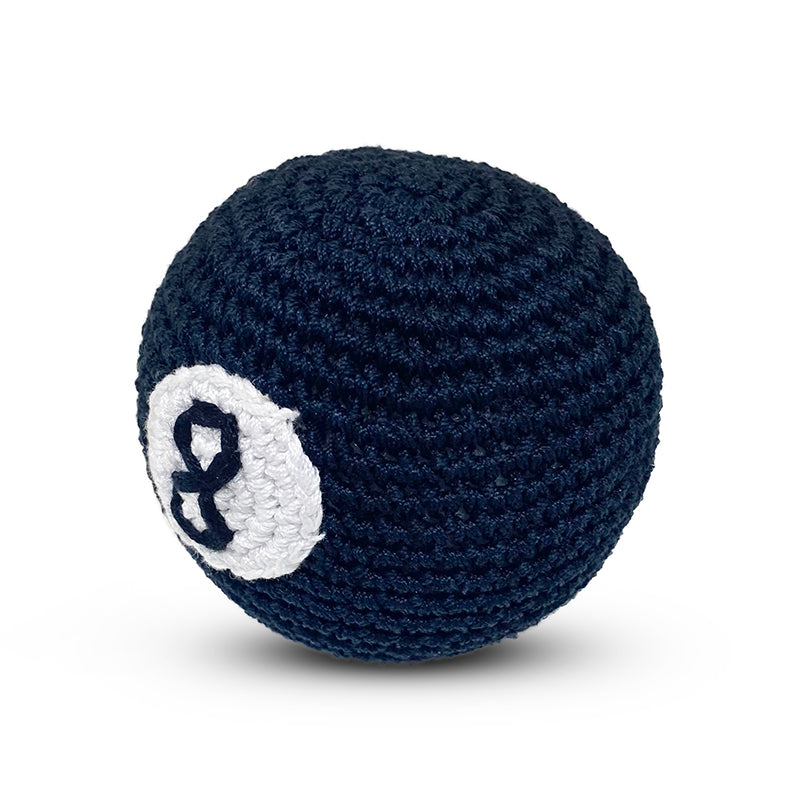 Crochet dog toy ball in dark navy with white 8-ball applique, side view