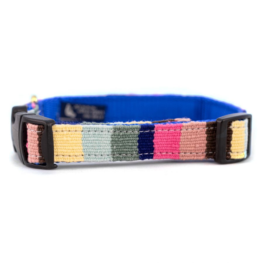 Handmade woven dog collar with multicolor stripe fabric and black plastic buckle.