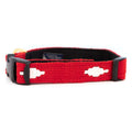 Red dog collar with white diamond pattern and black plastic buckle