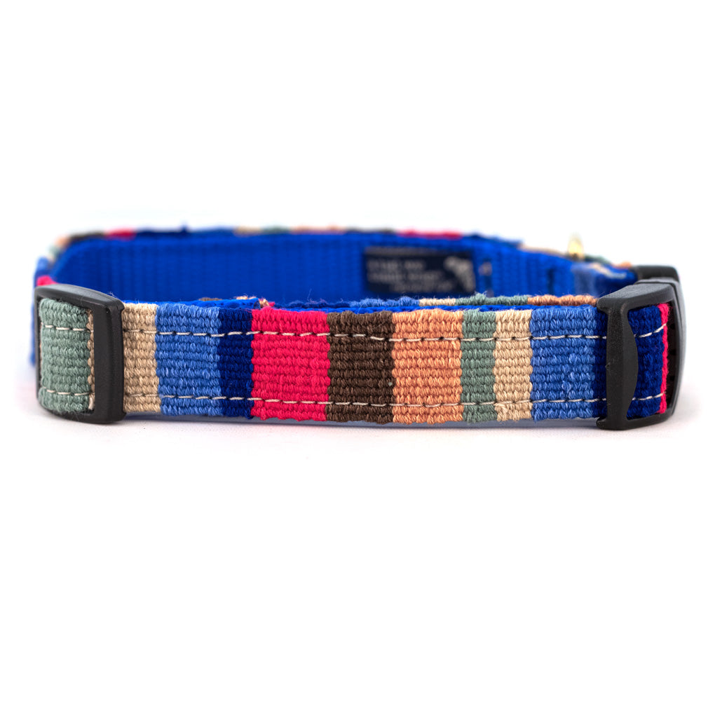 Handmade cotton dog collar with woven patchwork stripes in blue, red, tan, and dark brown