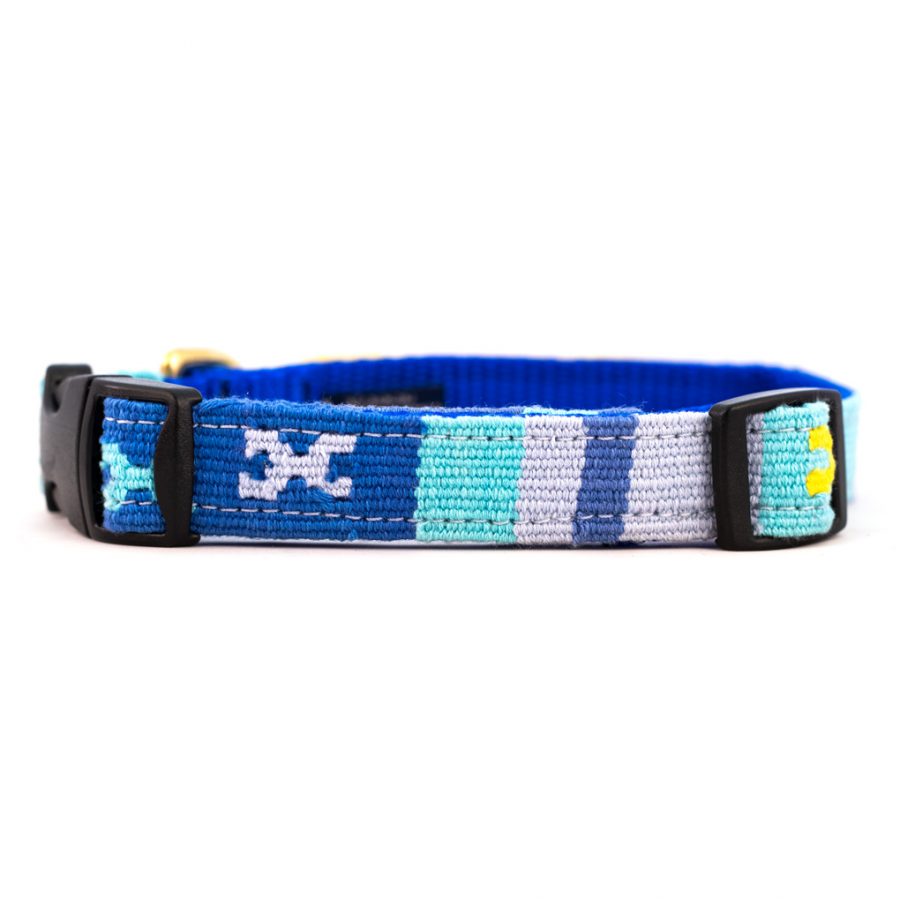 Woven cotton dog collar with geometric blue, teal, and white blocks; black buckle and D-rings