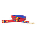 Red woven cotton dog leash with colorful geometric pattern and brass clip hardware
