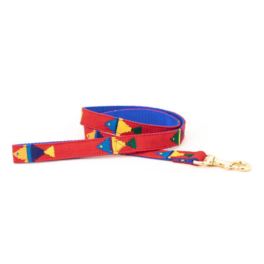 Red woven cotton dog leash with colorful geometric pattern and brass clip hardware