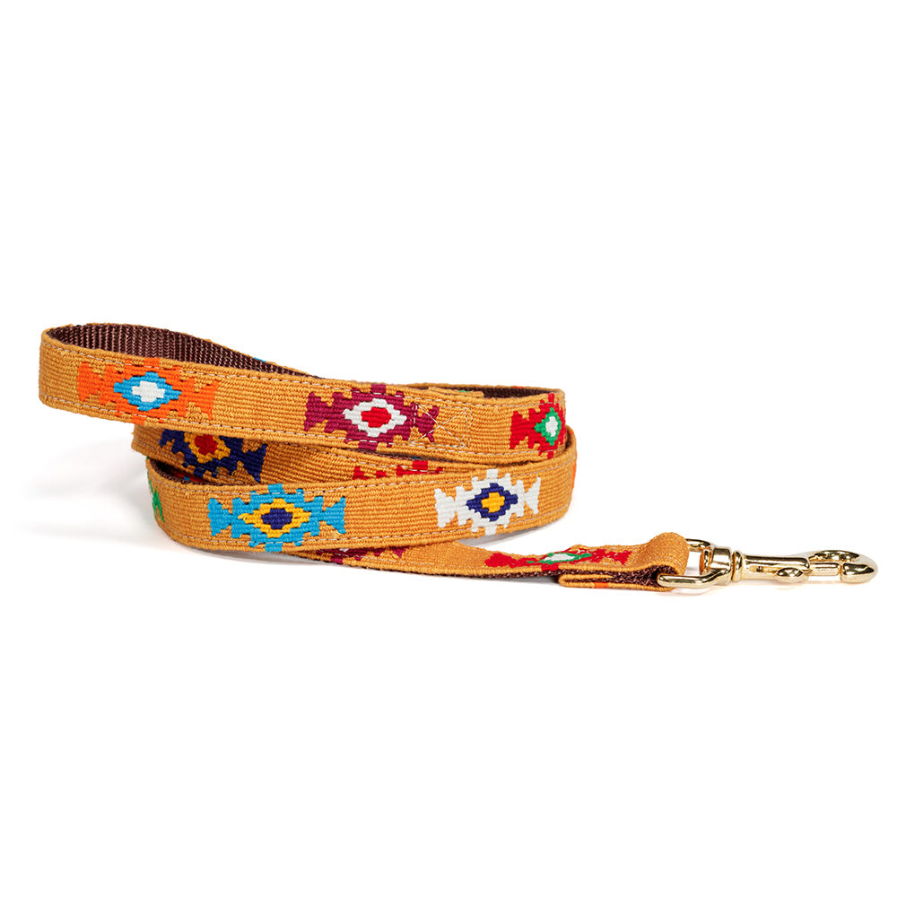 Woven cotton dog leash with colorful diamond pattern and gold-tone clasp hardware