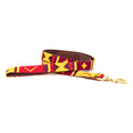 Handmade cotton woven dog leash with burgundy, yellow, and red geometric pattern and brass clip