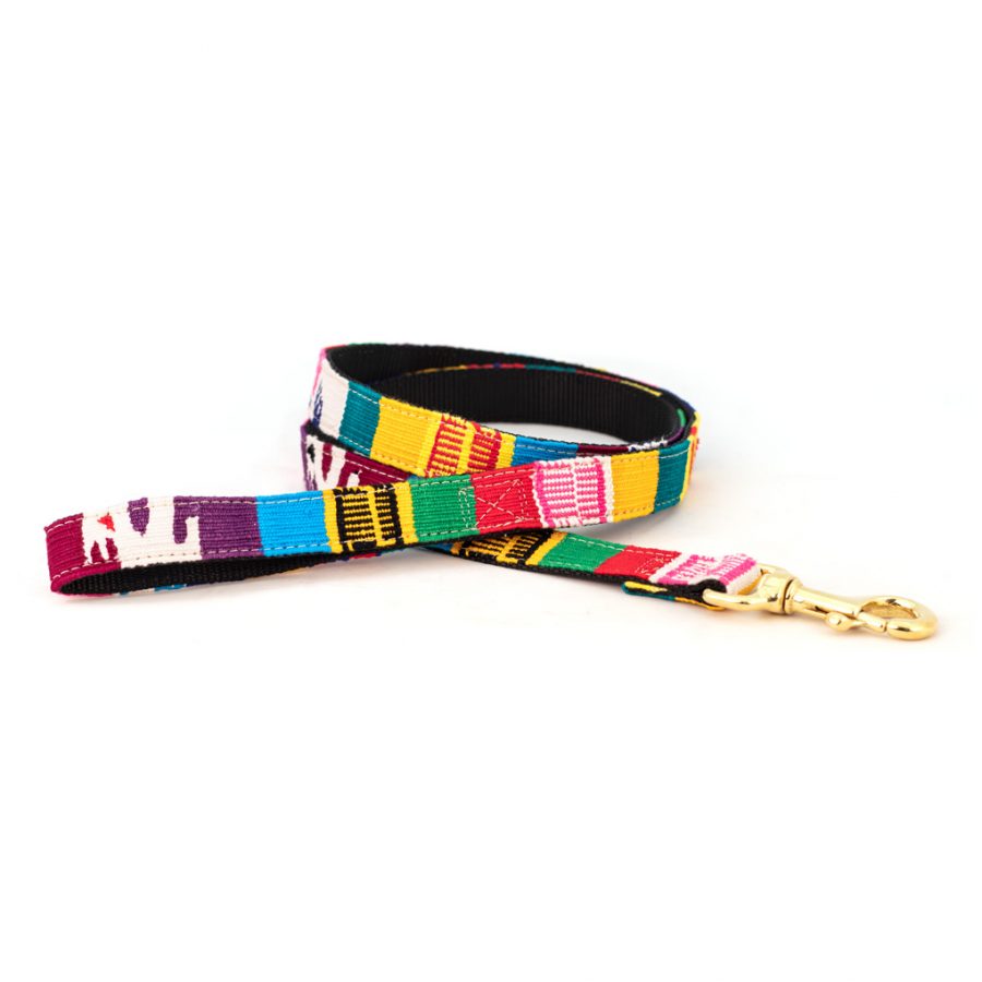 Woven dog leash with multicolor textile strap and brass clip, black backing