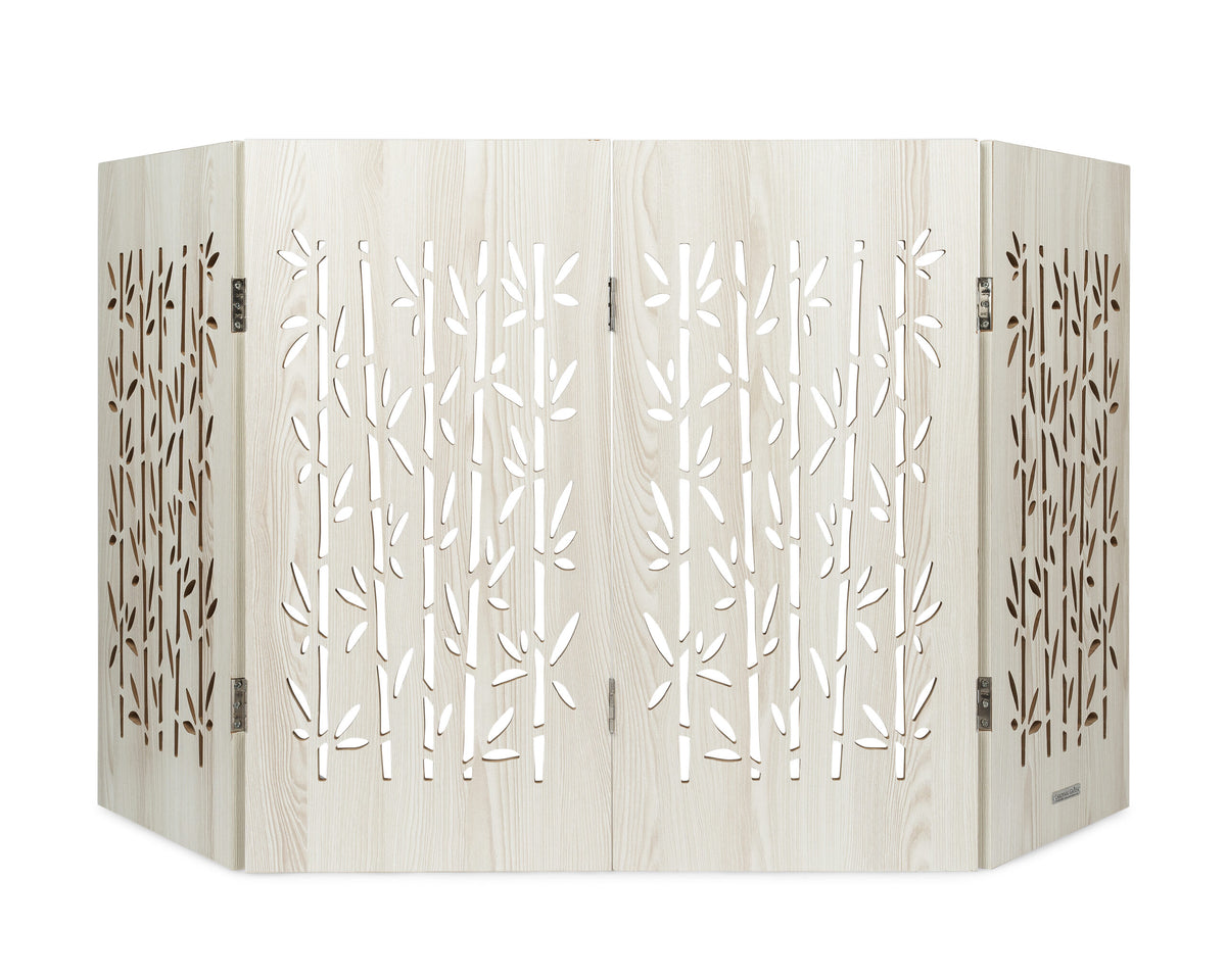 Freestanding indoor dog gate, light wood with leaf cutout decorative panels