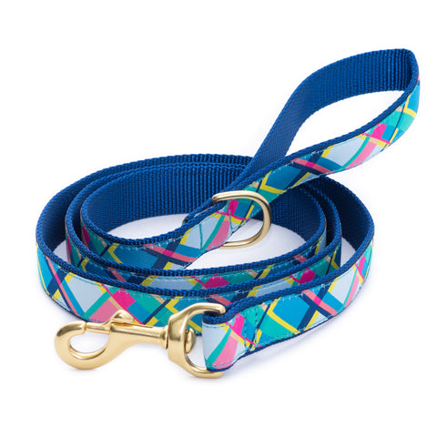 Plaid dog collar and matching leash set, blue webbing with colorful geometric pattern, brass hardware