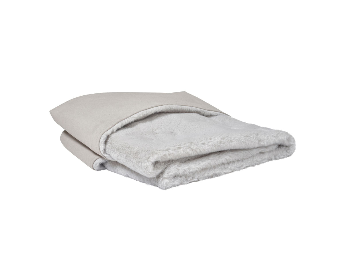 Reversible faux fur dog blanket in light grey, neatly folded