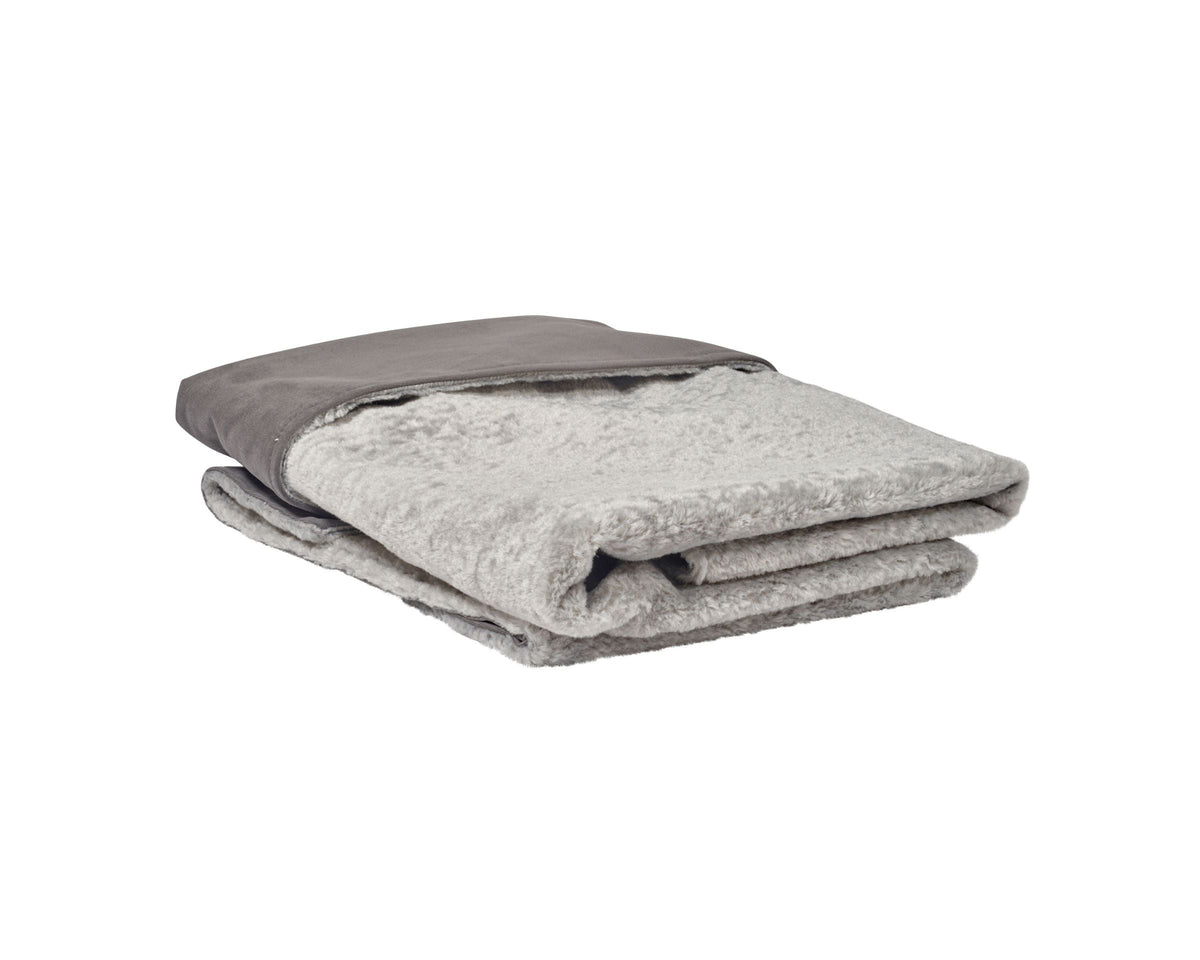 Reversible faux fur dog blanket, light gray folded with darker trim edge