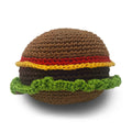 Crochet burger dog toy with brown bun, green lettuce, red tomato, and yellow cheese