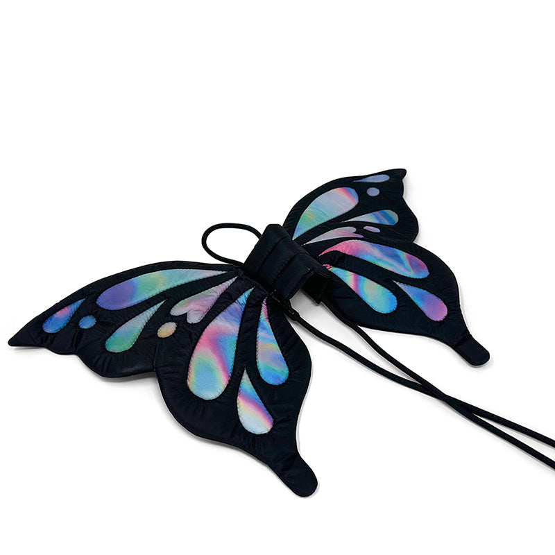 Butterfly wings dog costume in black with iridescent rainbow spots and bow tie straps