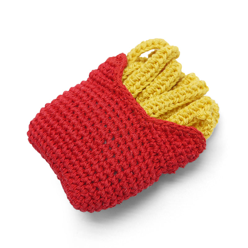 Crochet french-fries dog toy, angled view with red wrap and yellow top.