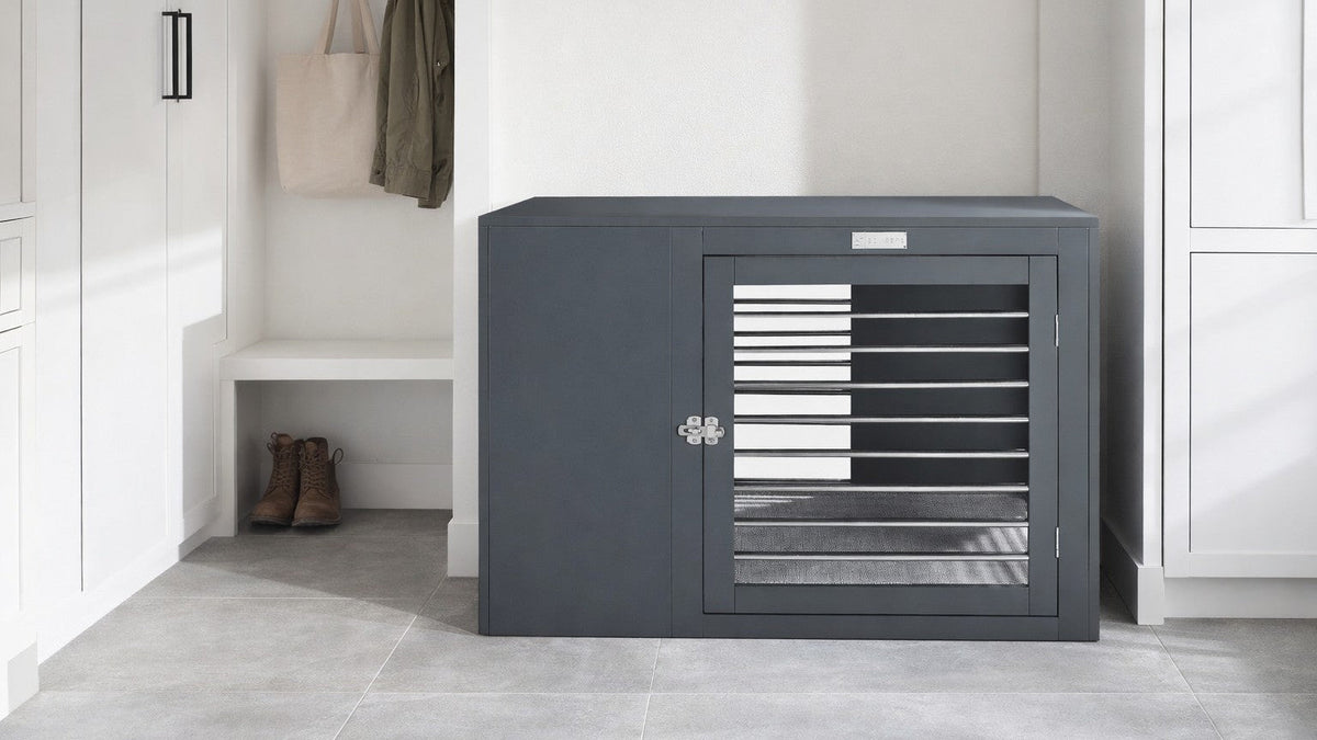 Gray modern dog crate with open front and metal slat doors in a room setting