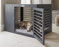 Gray modern dog crate with open side door and metal slat panels, with a sleeping dog inside