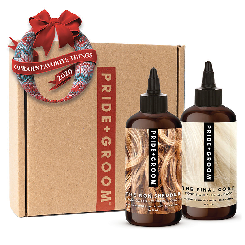 Dog shampoo and conditioner gift box set with two amber bottles for non shedding.