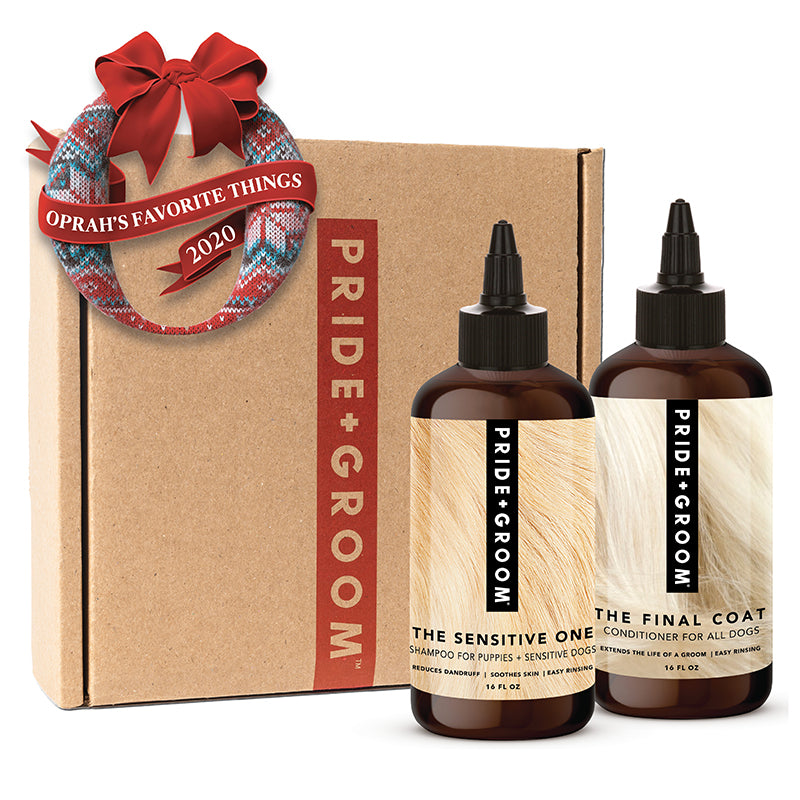 Dog shampoo and conditioner gift box set with two amber bottles for sensitive dogs.