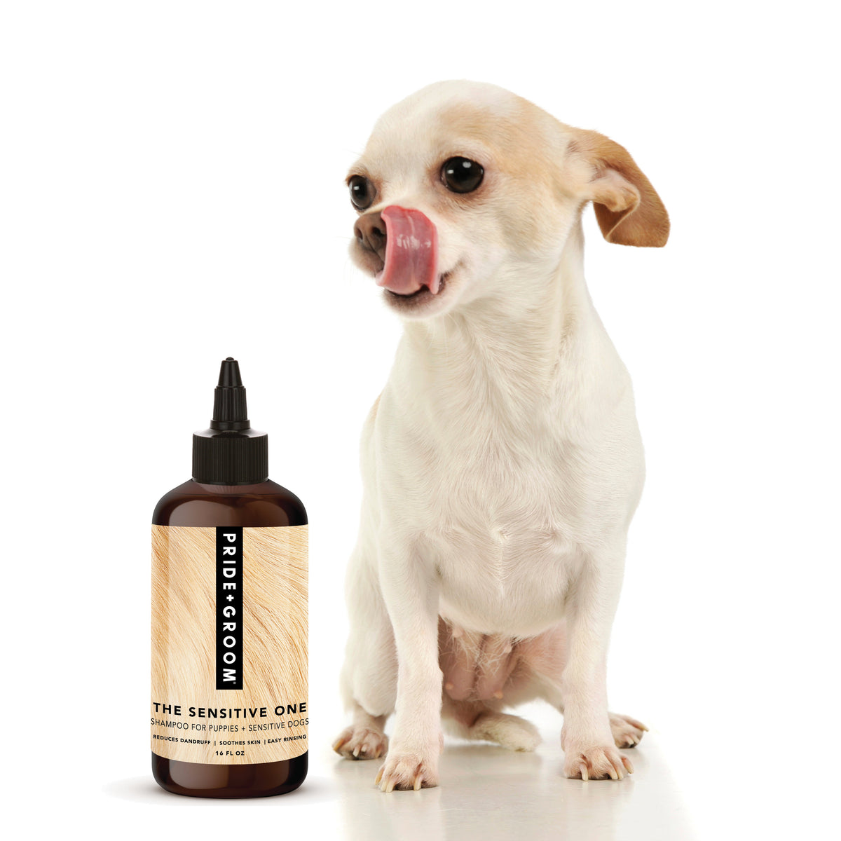 White dog sitting beside hypoallergenic shampoo bottle with dropper