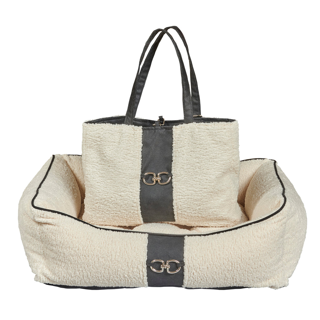 Ivory faux sheepskin scoop dog bed with dark center band and carry handles