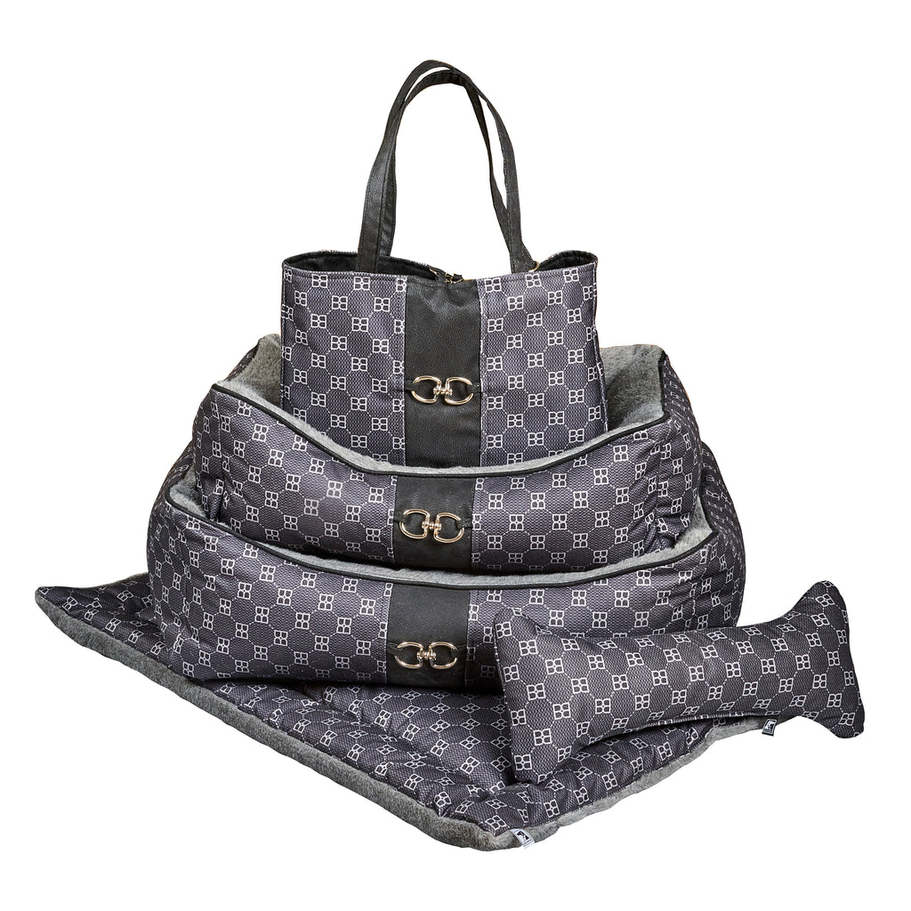 Stacked scoop dog beds set with gray-lined dark patterned fabric and carry handle