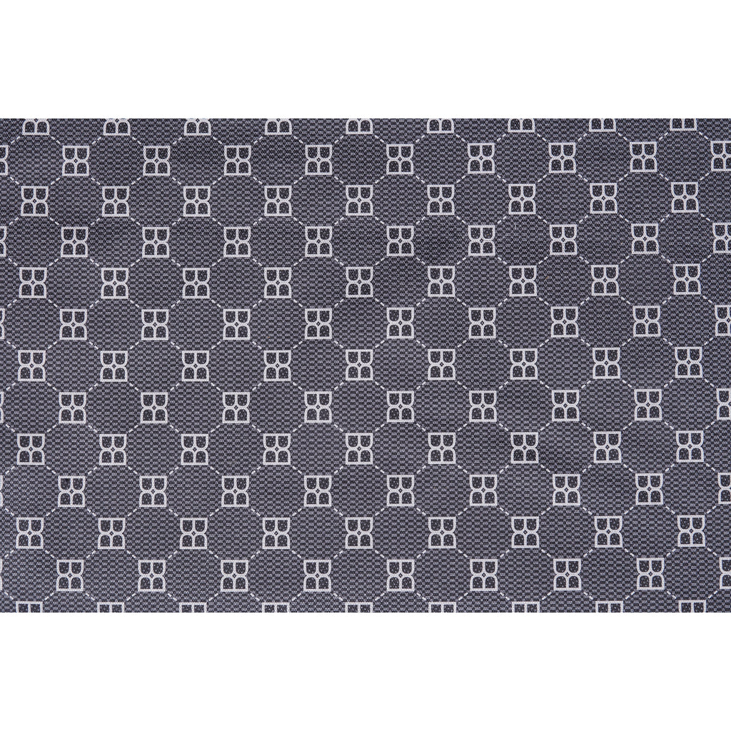 Close-up of dark fabric with small geometric pet pattern in white and gray
