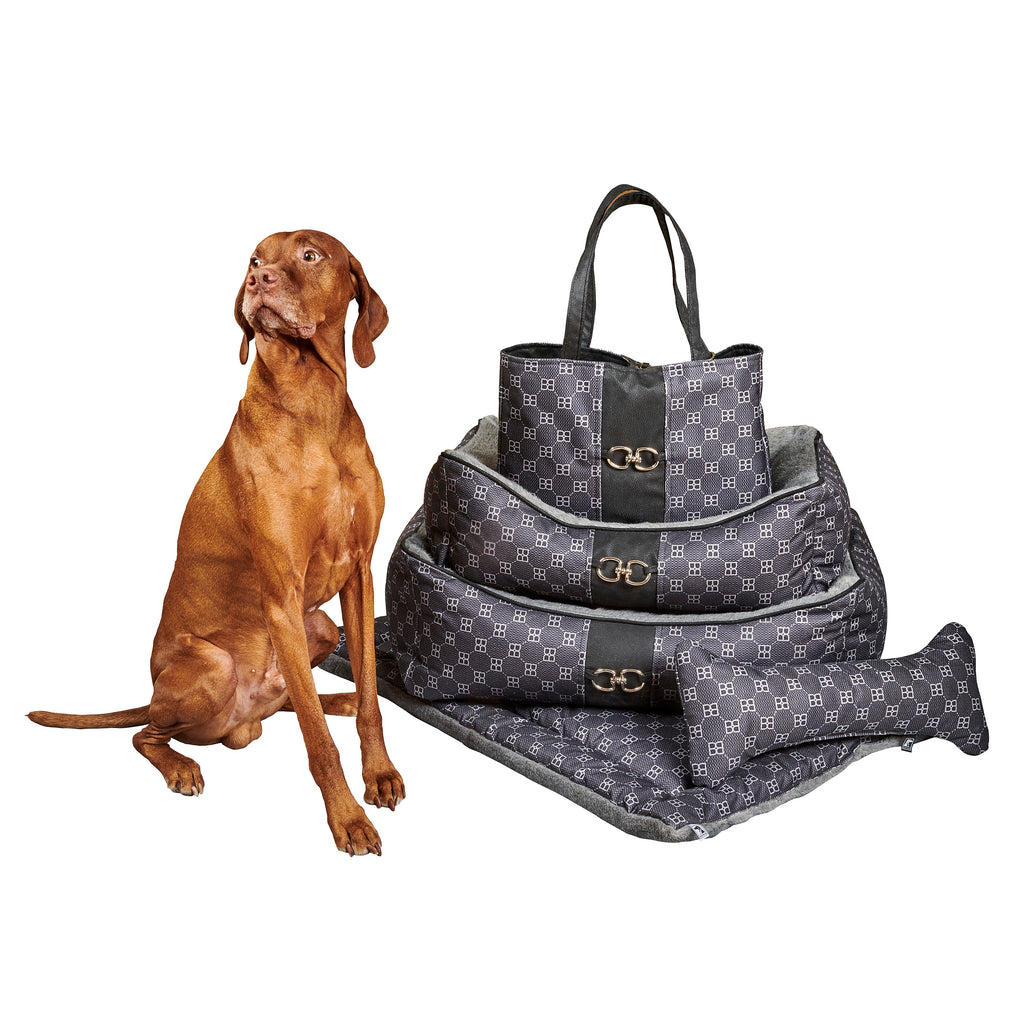 Dark patterned scoop dog bed with gray liner; gold-tone buckles and carry handle