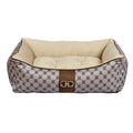 Beige patterned dog scoop bed with cushioned beige liner and brown center panel clasps