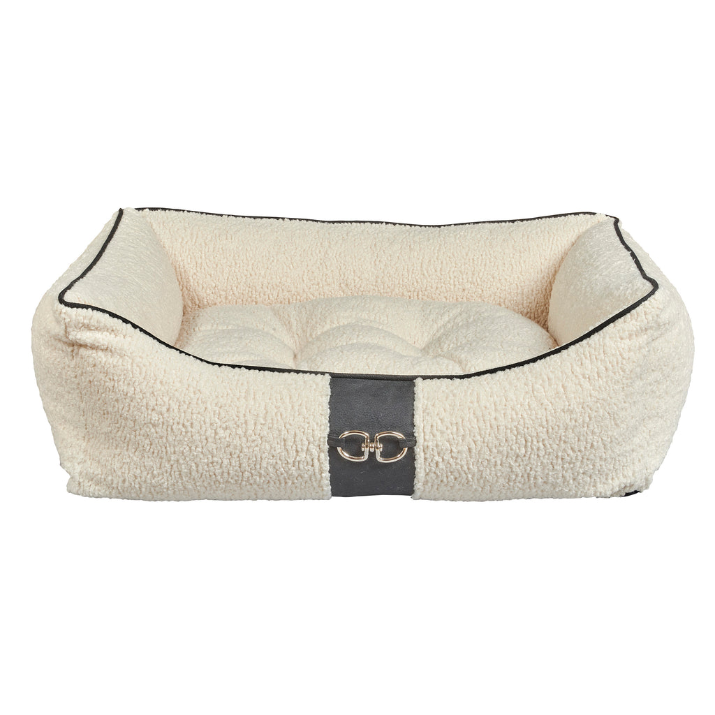 Ivory faux sheepskin scoop dog bed with dark trim and front buckle detail