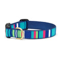 Striped dog collar in teal, blue, and multicolor with brass D-ring buckle