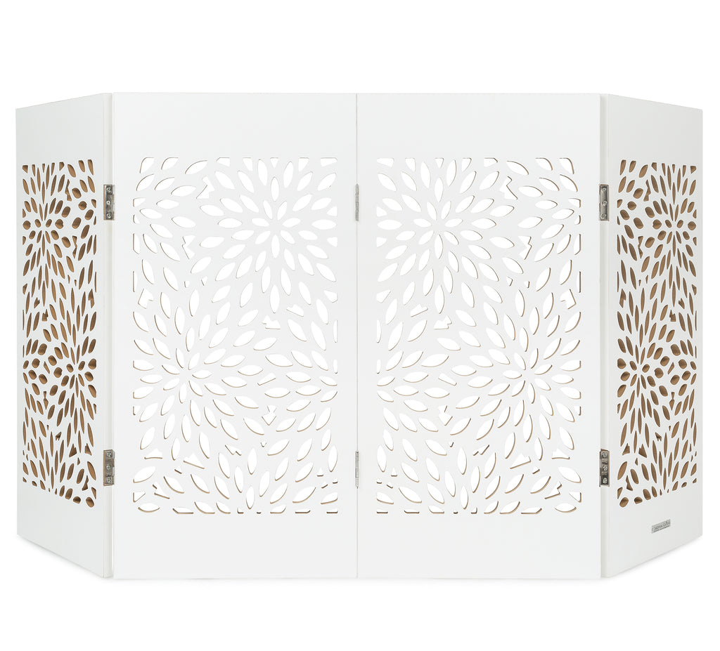 Freestanding indoor dog gate in white with starburst laser-cut panels and folding frame.