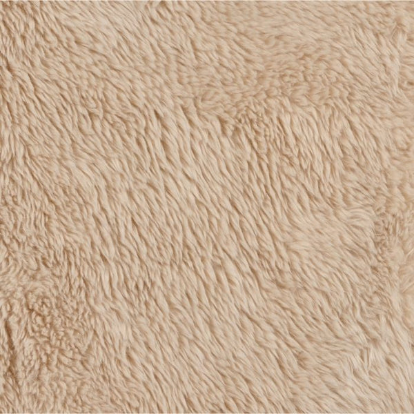Close-up of light beige faux fur dog blanket pile texture