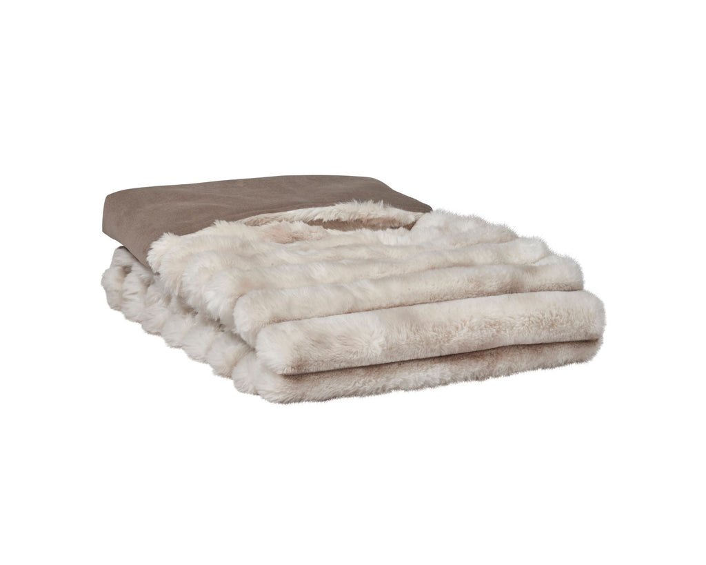 Reversible faux fur dog blanket in light beige, folded with thick shag pile