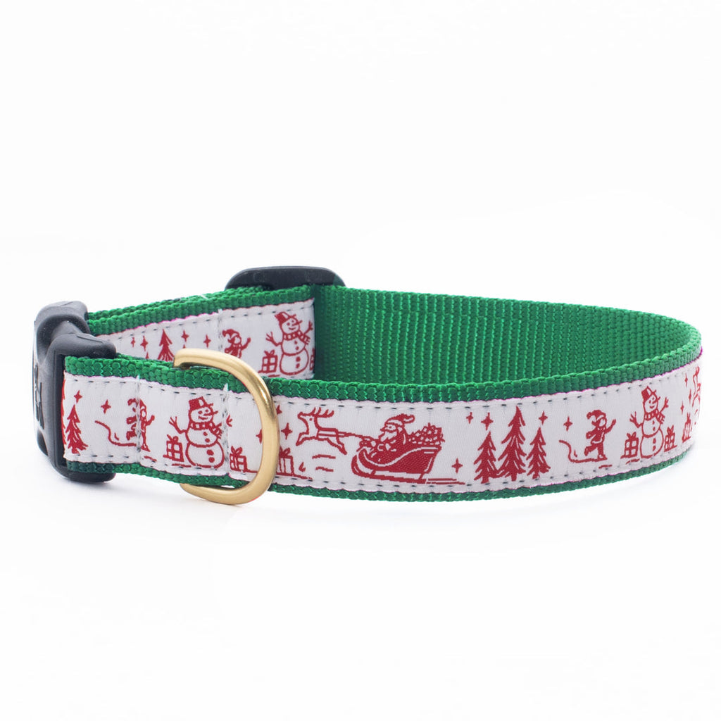 Green dog collar with red-and-white Christmas toile pattern and brass buckle