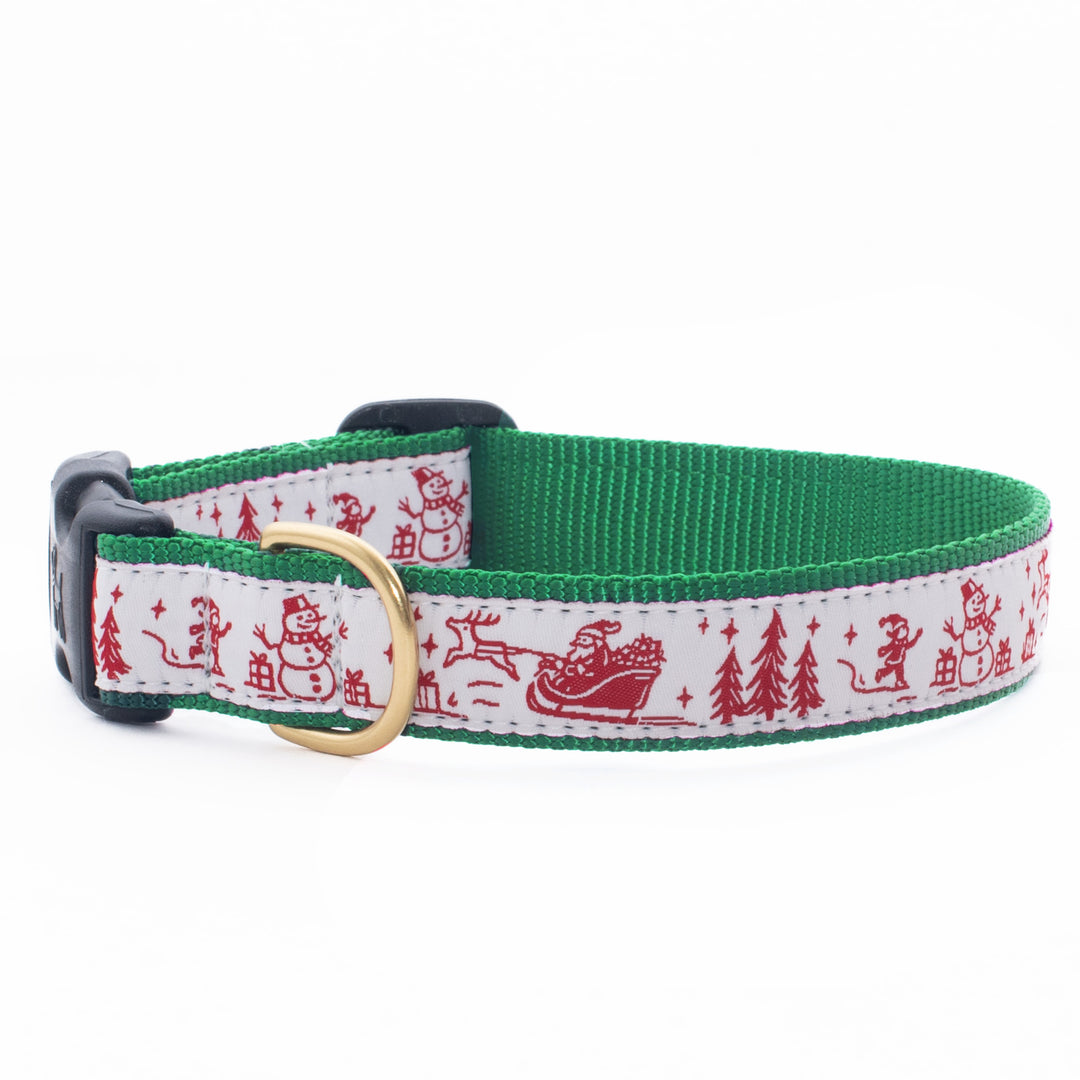 Green dog collar with red-and-white Christmas toile pattern and brass buckle