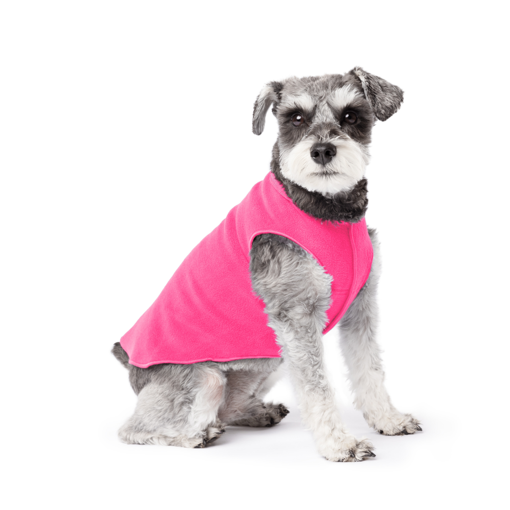 Hot pink stretch fleece dog coat, worn by a gray-and-white dog with short fur