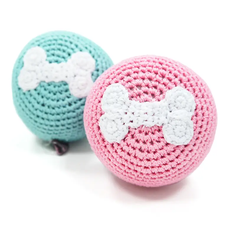 Crochet dog toy balls with bone design in pink and mint
