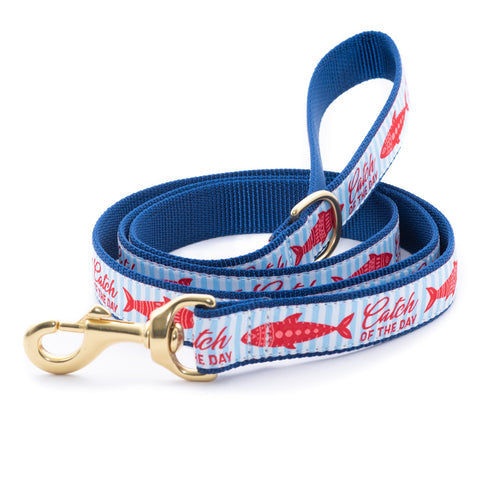 Blue dog leash and collar set with red fish print and gold hardware