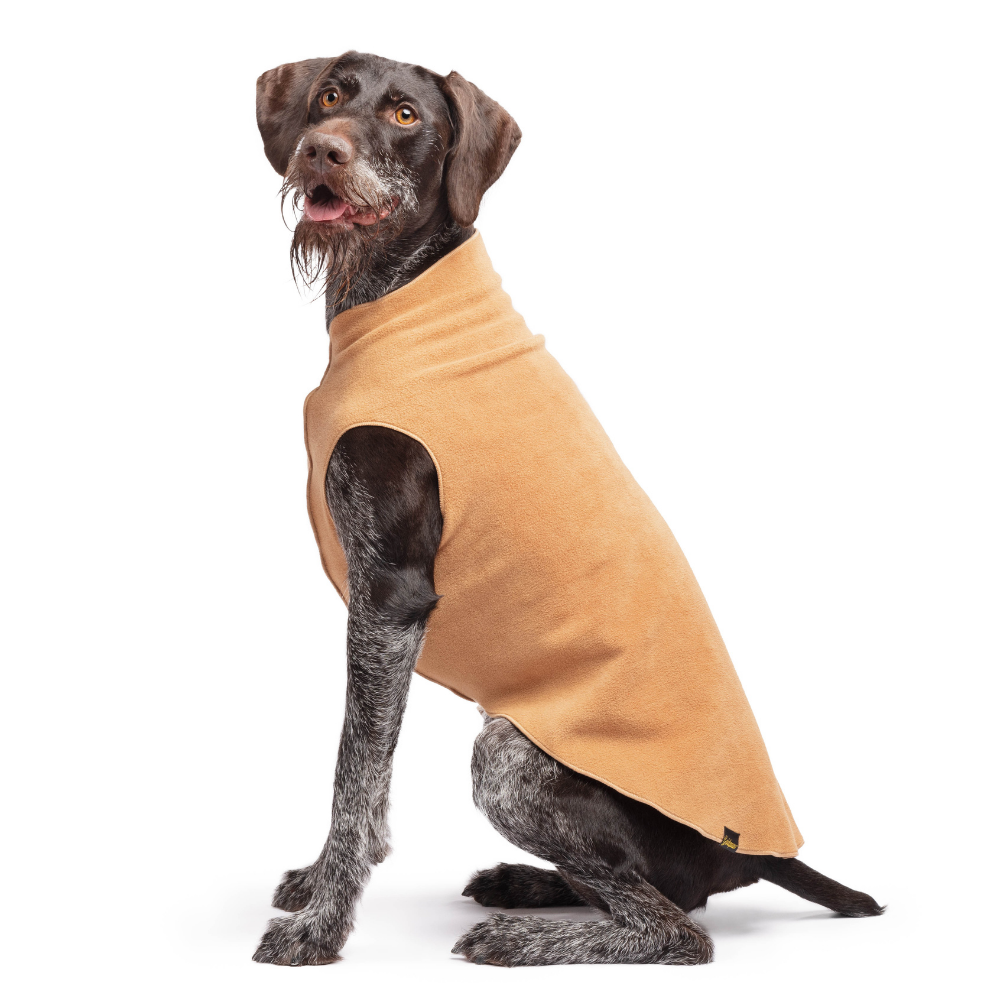 Tan stretch fleece dog coat with leg and head openings, worn by dark dog