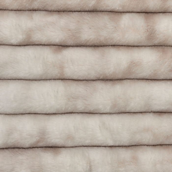 Close-up of light beige faux fur dog blanket pile texture