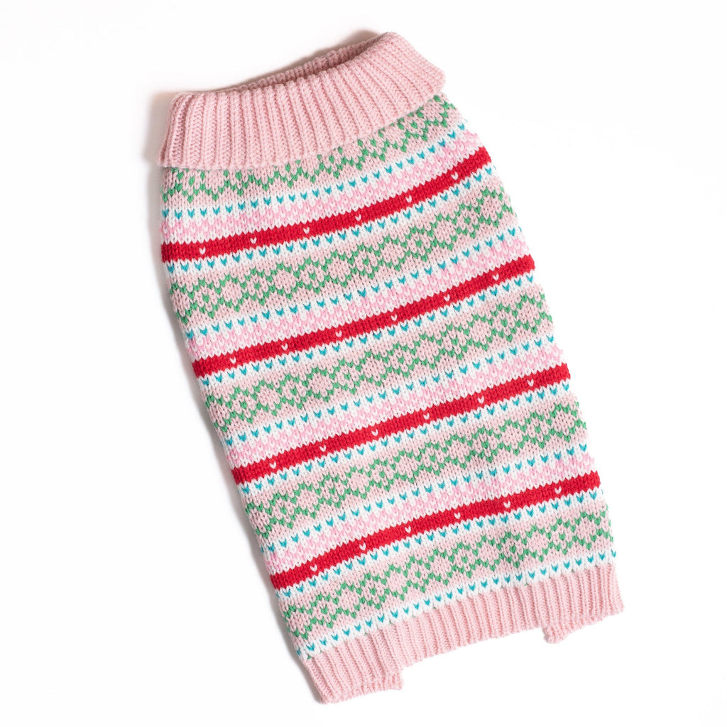 Pink knit dog sweater with ribbed turtleneck and green, red, and white striped pattern