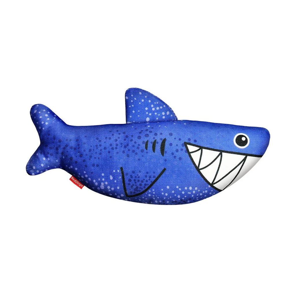 Blue plush shark dog toy with white teeth and dotted pattern, red brand tag