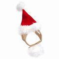 Dog Santa hat with red pointed crown, white faux-fur trim, and fluffy pom-pom