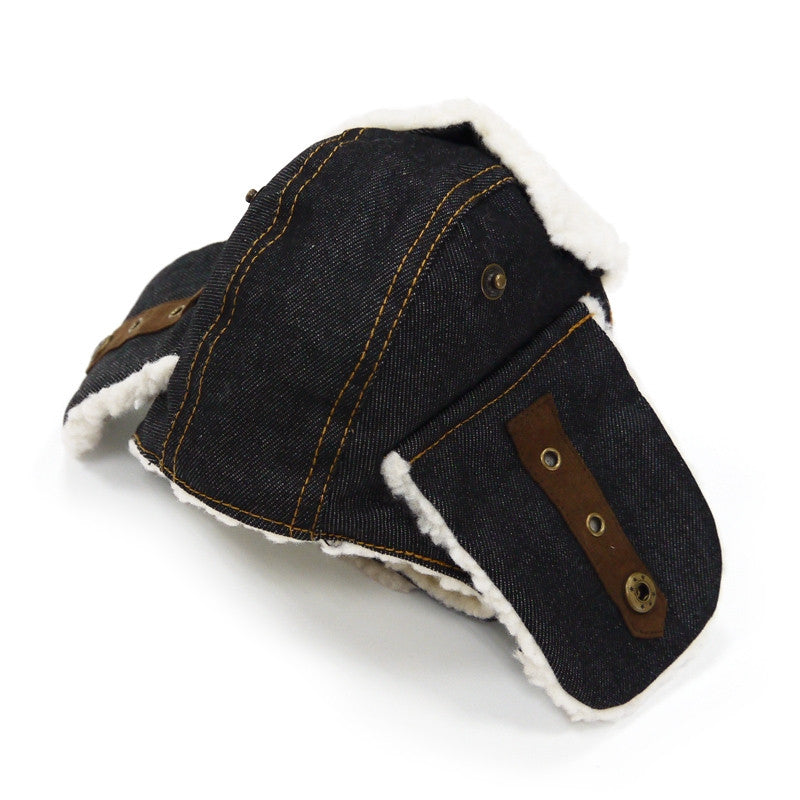 Dog trapper hat dark denim with tan leather patch, brass buttons, white fleece trim