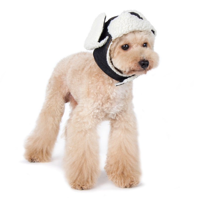 Dog trapper hat with white sherpa lining and black ear flaps, adjustable chin strap