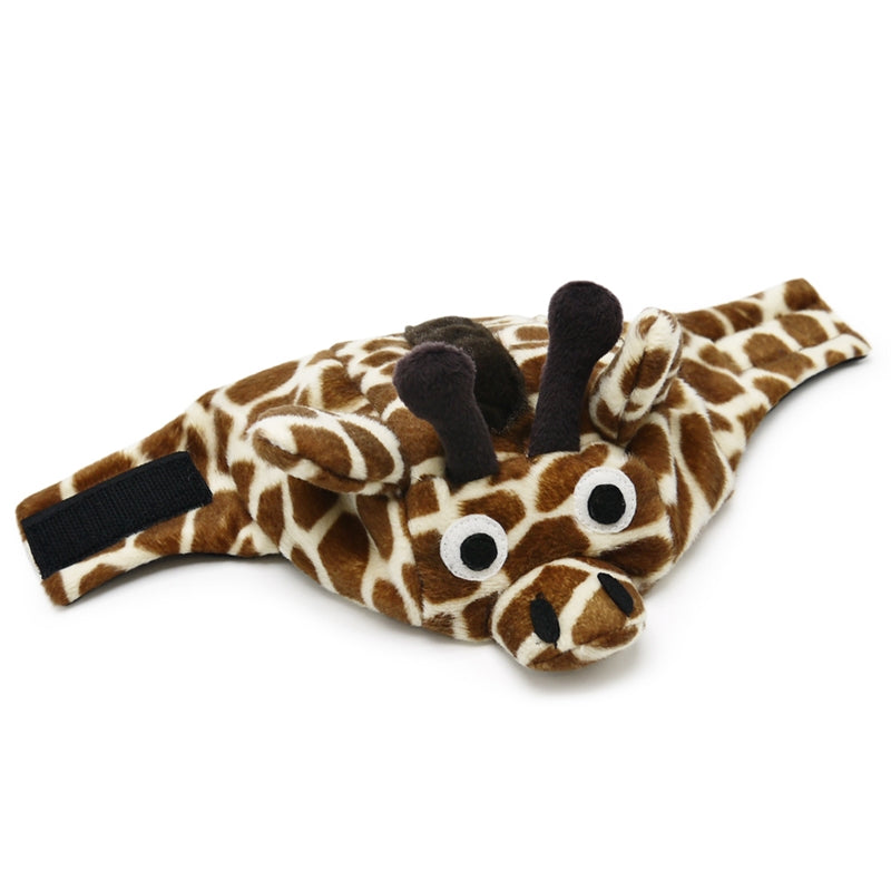Giraffe plush dog hat lying flat, with black chin strap and horn details