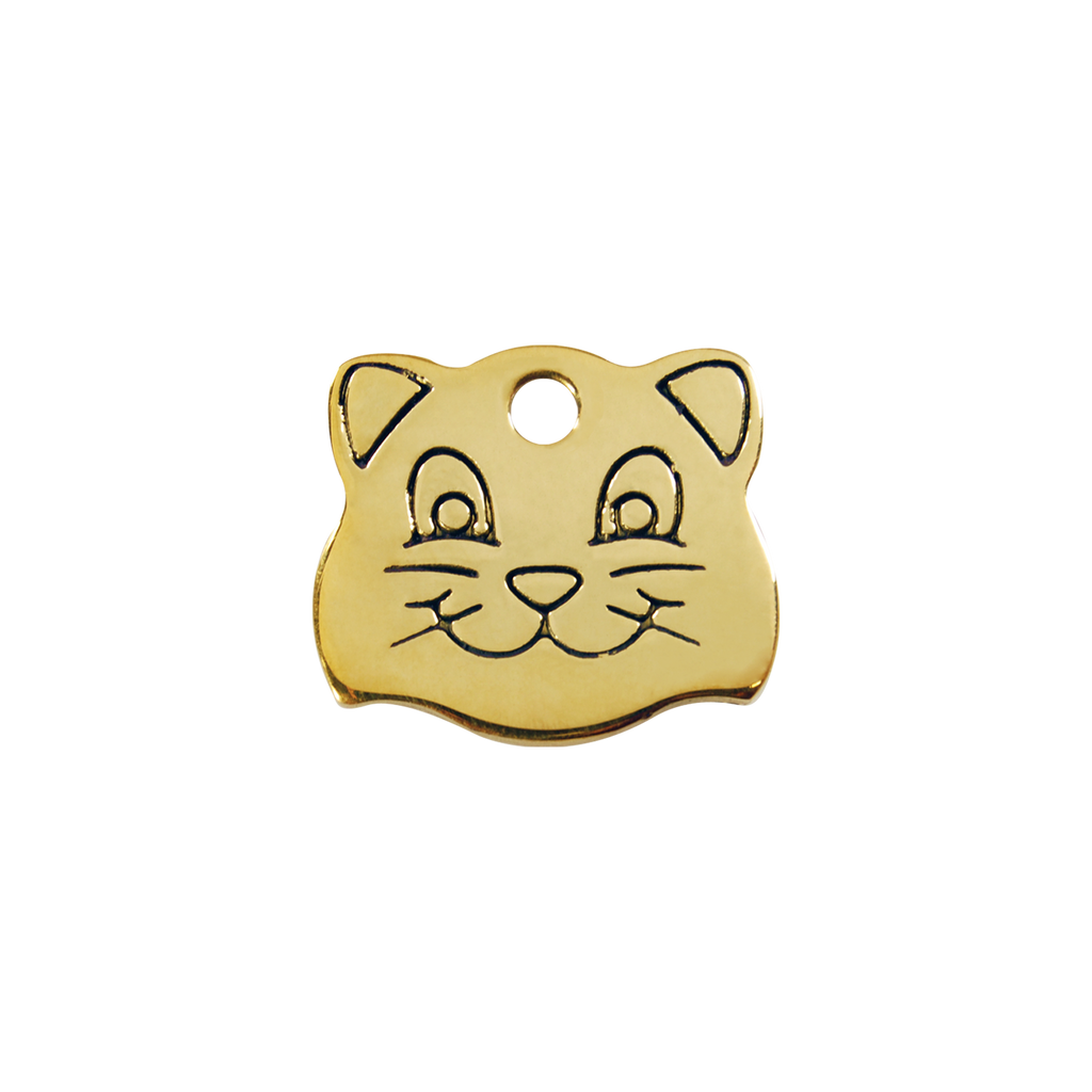 Brass cat face-shaped pet ID tag with circular hole and engraved face details.
