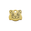 Brass cat face-shaped pet ID tag with circular hole and engraved face details.