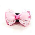 Pink polka-dot dog bow tie with ribbed bow and rhinestone-like trim