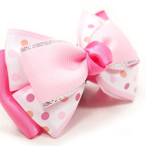Pink ribbed dog bow tie with polka-dot accents and satin center knot