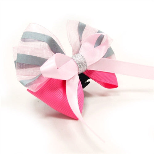 Dog bow tie with pink and pastel striped bow, black center, long tail